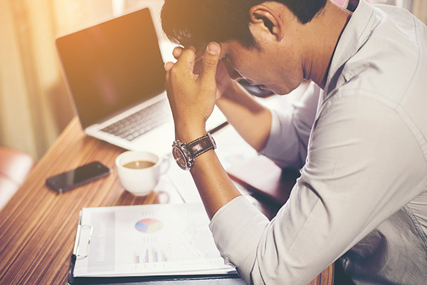 anxious man at computer